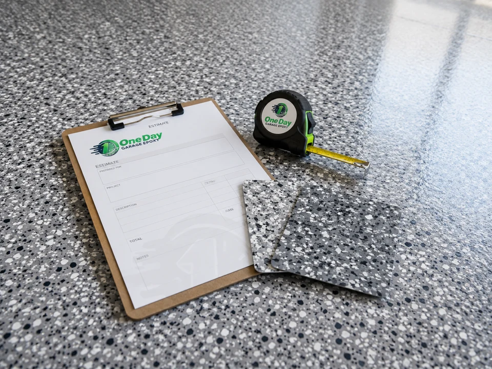 Estimate clipboard and tape measure resting on a finished epoxy floor