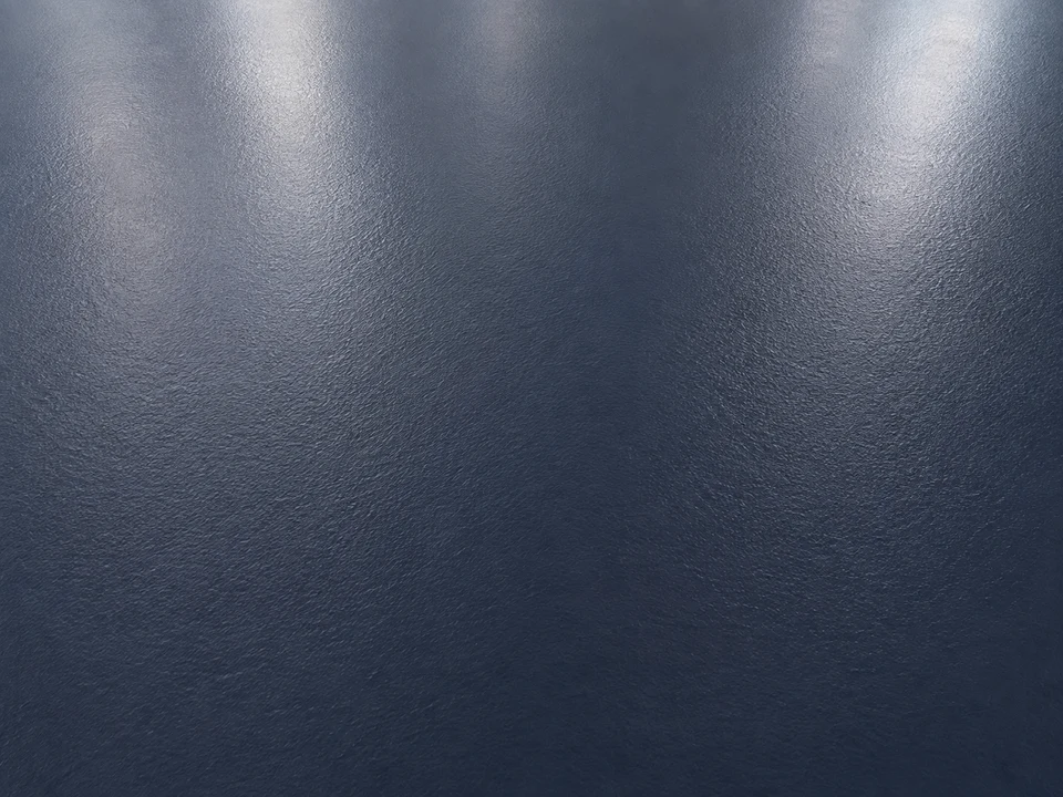Close-up of a solid dark navy epoxy floor with a smooth satin finish